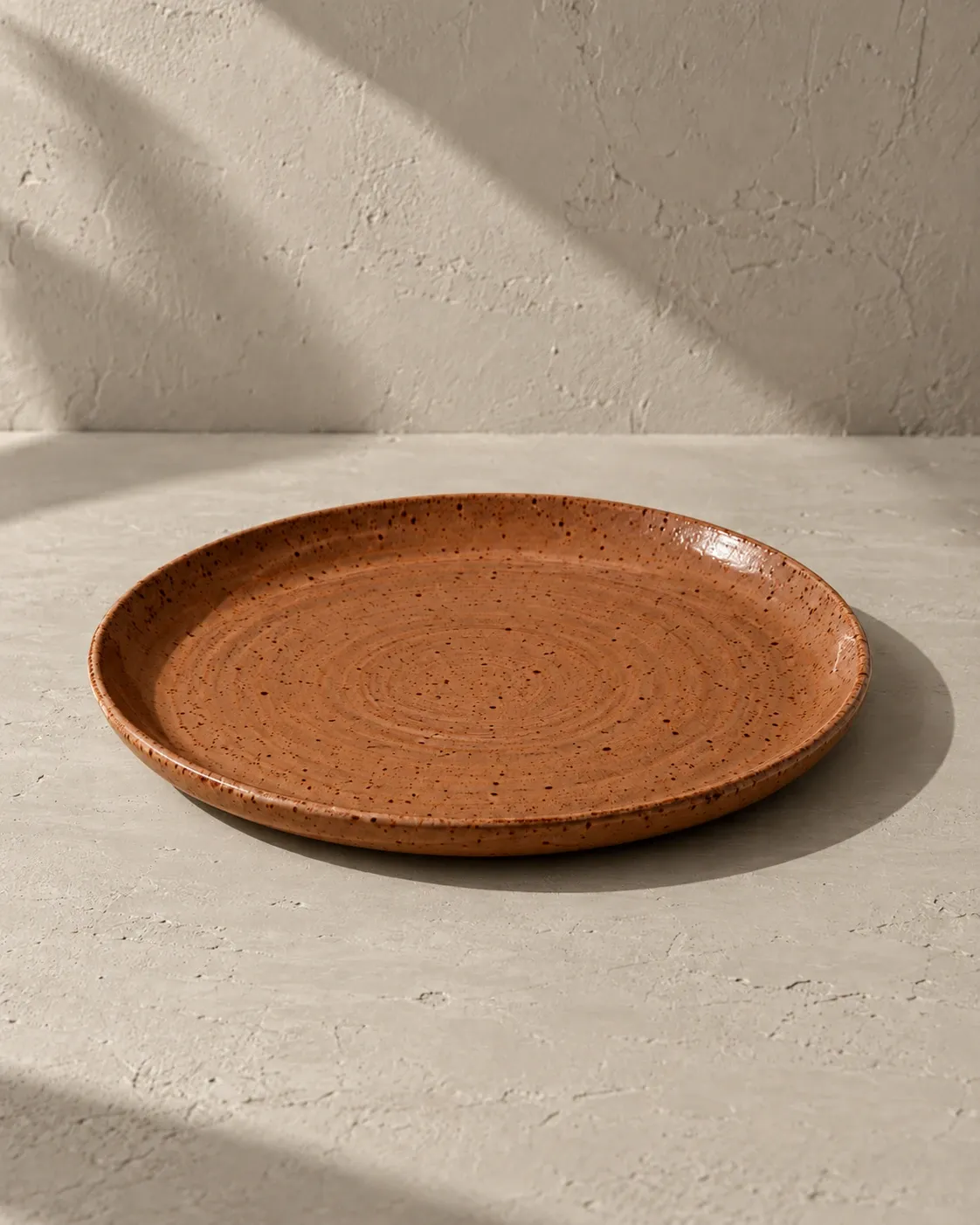 Dinner Plate in Clay, a muted terracotta glaze